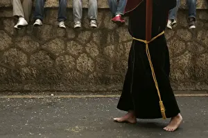 General Prints: Penitent takes part in the procession of Penas brotherhood during Holy Week in Malaga