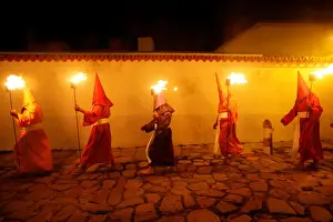 Latin America Prints: Penitents attend the Procession of the Torches during Holy Week in Goias Velho, west