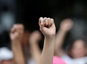 People affected by the September 19, 2017 earthquake hold up their hands as they take