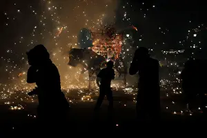 Mexico Prints: People enjoy fireworks exploding from a traditional bull figure known as El Torito in