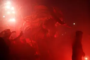 : People enjoy fireworks exploding from a traditional bull figure known as El Torito in