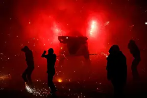 Mexico Prints: People enjoy fireworks exploding from a traditional bull figure in Tultepec