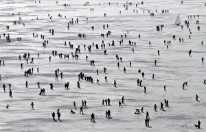 Weather Prints: People enjoy a sunny winter afternoon on the frozen Lac de Joux in Le Pont