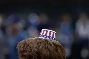 Prints of A woman attends the 2018 National Memorial Day Parade held by the American Veterans Center, in Washington, U.S. May 28, 2018. REUTERS/Toya Sarno Jordan TPX IMAGES OF THE DAY USA Prints: People participate in the 2018 National Memorial Day Parade in Washington