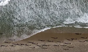 People play with soccer balls at Ipanema beach in Rio de Janeiro