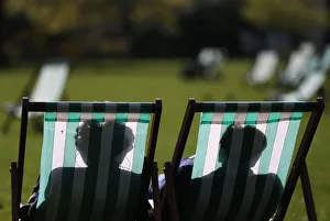 Prints of People relax on deck chairs on a warm day in London, Britain May 4, 2016. REUTERS/Neil Hall TPX IMAGES OF THE DAY Britain Prints: People relax on deck chairs on a warm day in London, Britain