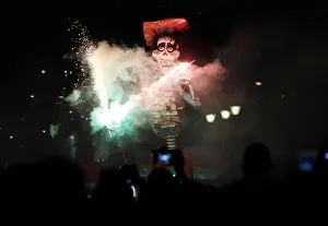 Easter Prints: People set fire to an effigy during the traditional burning of Judas on Holy Saturday in