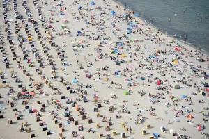 Weather Prints: People sitting in beach chairs enjoy the hot sunny weather at the Baltic Sea resort