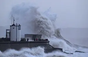People view large waves and high winds associated with Storm Eleanor as they hit