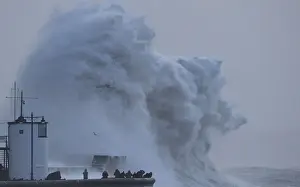 Storm Prints: People view large waves and high winds associated with Storm Eleanor as they hit