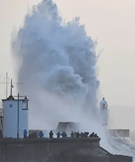 People view large waves and high winds associated with Storm Eleanor as they hit