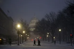 Weather Prints: People walk in the falling snow near the U. S. Capitol in Washington