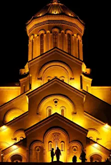 Christmas Prints: People walk in front of the Holy Trinity cathedral during a midnight Christmas service in