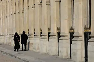 People walk on a warm spring morning in the Jardin du Palais Royal