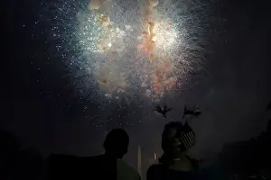 People watch fireworks during the 4th of July Independence Day celebrations