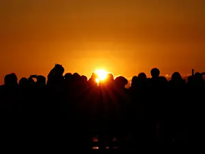 People watch the first sunrise on New Years Day at Roppongi Hills observation deck