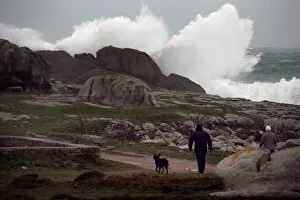 Weather Prints: People watch waves breaking on the Brittany coast after storm Eleanor hit Saint-Guenole
