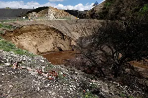 Prints of Personnel is pictured around a portion of a hillside which gave in due to heavy rain in a wildfire affected area of La Tuna Canyon Road in Sun Valley, California, U.S. March 23, 2018 USA Prints: Personnel is pictured around a portion of a hillside which gave in due to heavy rain in a