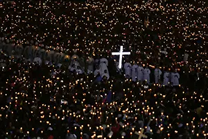 Pilgrims attend a candlelight vigil at the Catholic shrine of Fatima