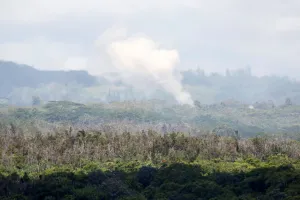 A plume of steam and gas rises from a fissure east of the Leilani Estates subdivision A plume of steam and gas rises from a fissure east of the Leilani Estates subdivision
