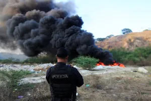 Images Dated 2017 April: A police officer takes a picture during the incineration of seized cocaine in Ilopango