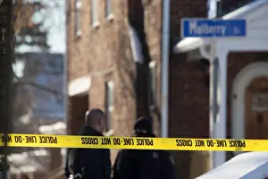 Police officers guard an intersection after officer-involved shooting in Harrisburg