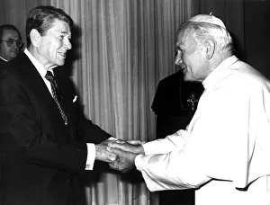 Trending: POPE JOHN PAUL II SHAKES HANDS WITH U. S. PRESIDENT REAGAN DURING MEETING AT VATICAN