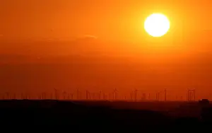 Energy Prints: Power-generating windmill turbines are pictured during sunset from the Drachenberg hill