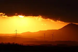 Images Dated 2017 September: Power-generating windmill turbines are pictured during the sunset near Larnaca