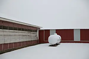 A propane tank stands outside a hog building at Duncan Farms in Polo