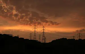 Peru Prints: Pylons of high-tension electricity power lines are seen near houses at Villa Maria del