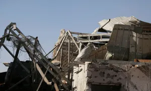 Mideast Prints: The remains of al-Hadba minaret at the Grand al-Nuri Mosque is pictured behind the ruins