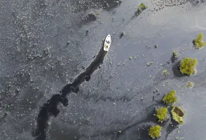 Images Dated 2011 May: Residents on a boat navigate down a flooded farm in the municipality of Cajica near in