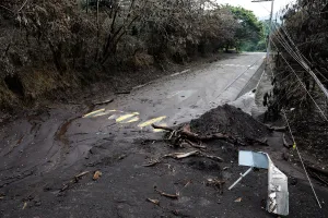 Guatemala Prints: A road affected by a lahar from Fuego volcano is seen in El Rodeo