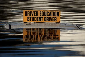 Storm Prints: The roof a student driver car is pictured partly underwater as a result of Hurricane