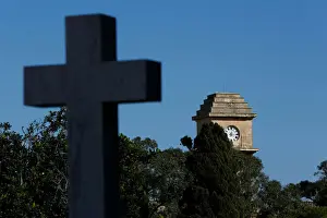 The Saint Patricks Barracks clock tower is seen from the Pembroke Military Cemetery in