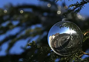 Saint Peters Square is reflected on an ornament as Pope Francis leads the Angelus