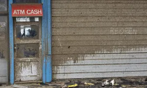 A scrawled message to reopen is written on the door of an arcade at the FunTown Amusement A scrawled message to reopen is written on the door of an arcade at the FunTown Amusement