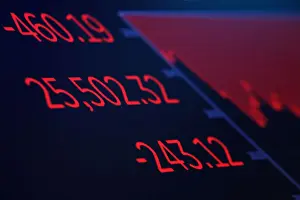 Stock Prints: A screen displays the Dow Jones Industrial Average after the closing bell on the floor of