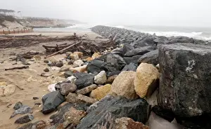 France Prints: Sea wall on the beach that protect sand dunes from erosion along the Atlantic Ocean coast