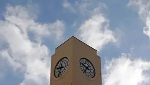Time Prints: A seagull flies past a broken tower clock which does not indicate the correct time in