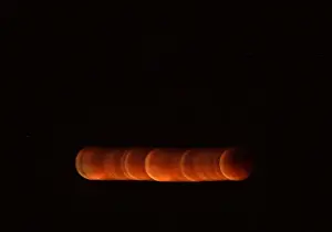 The shadow of the earth falls on the moon during a total lunar eclipse in Malaga
