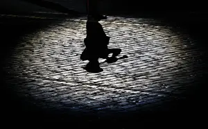 Prints of The shadow of a participant is cast onto the ground during the International Military Music Festival Spasskaya Tower in Red Square in Moscow, September 1, 2013 Russia Prints: The shadow of a participant is cast onto the ground during the International Military