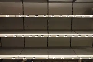 Empty shelves for headlights, lanterns and other supplies are seen at a Home Depot store