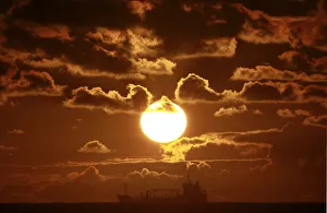 Prints of A ship crosses Coogee beach bay in Sydney at sunrise February 14, 2013. REUTERS/Daniel Munoz (AUSTRALIA - Tags: SOCIETY MARITIME TPX IMAGES OF THE DAY) Australia Prints: A ship crosses Coogee beach bay in Sydney at sunrise