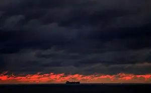 Sri Lanka Prints: A ship sails towards Colombo main harbour as the rainy clouds gathered above the sunset