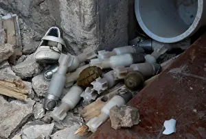 Mideast Prints: A shoe is seen among a pile of unexploded ordnance at the positions of the Iraqi forces