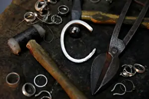 : Silver jewellery parts and work tools are seen in the workshop of goldsmith Gavriel