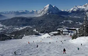 Skiers make their way down a slide during the first sunny day in 2015 in the Tyrolean