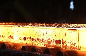 : A slab of steel rolls down the line at the Novolipetsk Steel PAO steel mill in Farrell